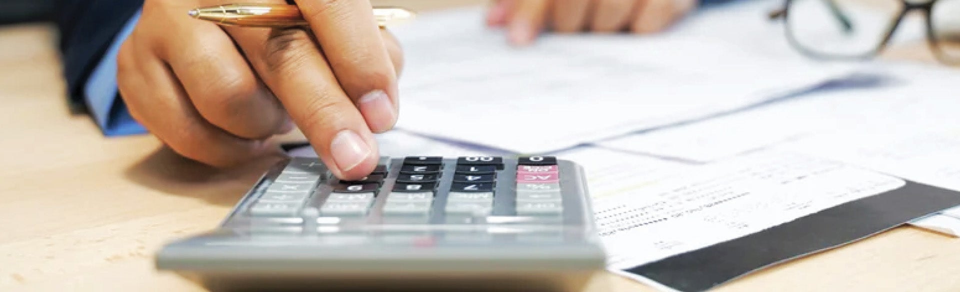 business professional crunching numbers on a calculator